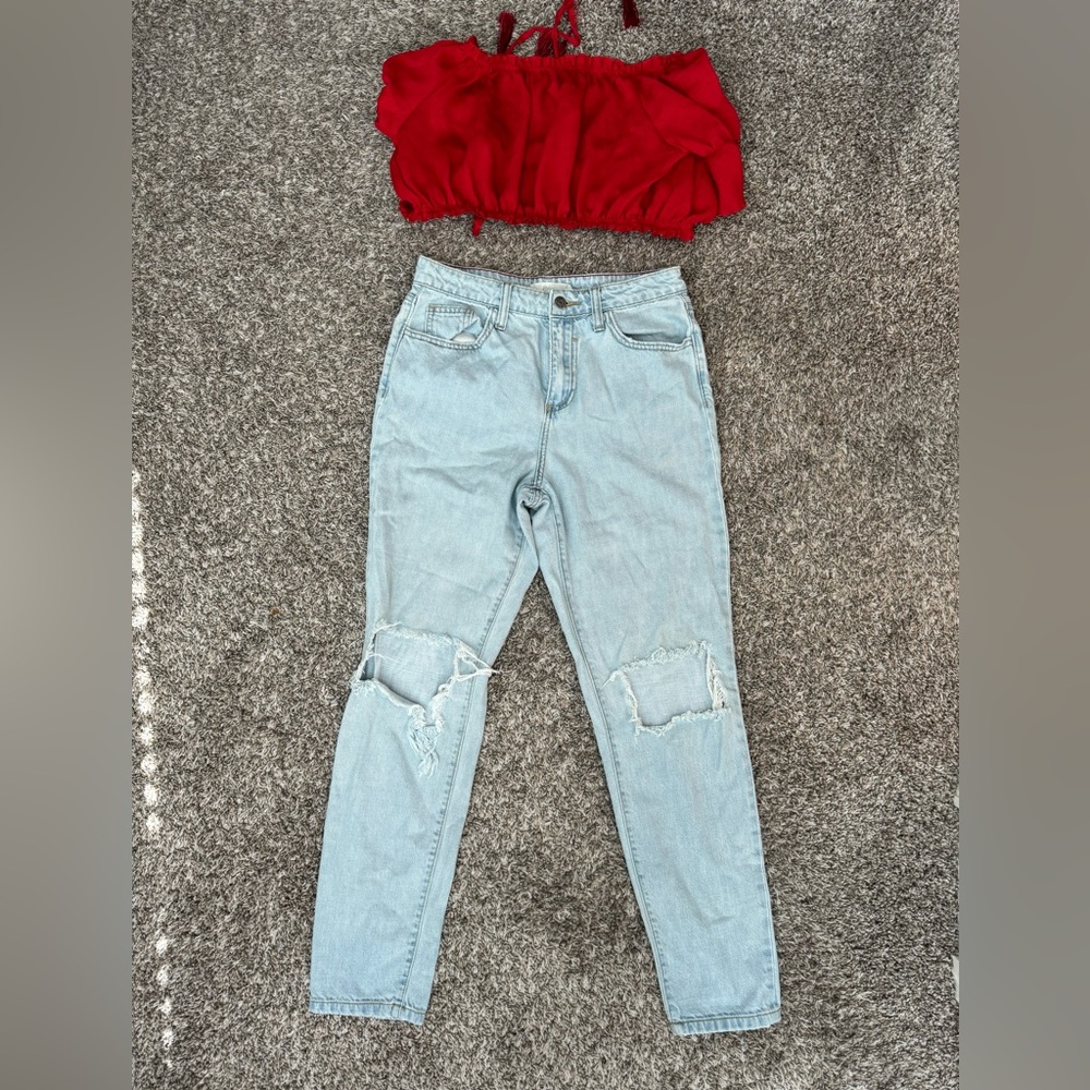 Denim boyfriend jeans paired with red crop top